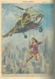 Coraggiosa acrobata esegue i suoi esercizi su un trapezio agganciato a un elicottero librantesi nel cielo di New York.